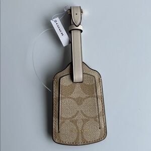 Coach Tan Luggage Tag with gold hardware in signature canvas